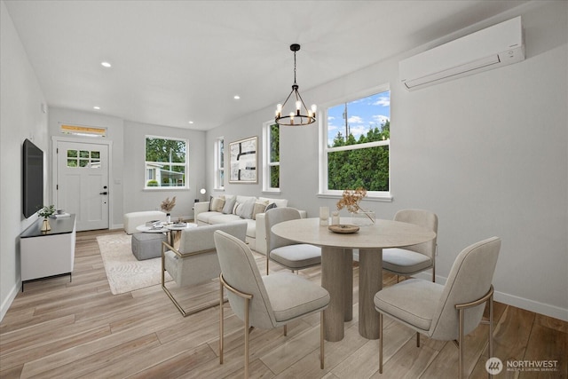 4955 Henley St, Blaine, WA 98230 - dining space featuring a wall mounted air conditioner, light wood-style floors, a chandelier, and recessed lighting