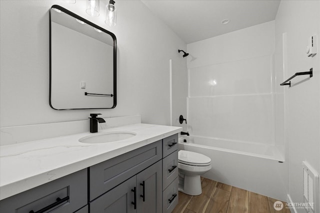 4955 Henley St, Blaine, WA 98230 - bathroom with vanity, wood finished floors, and shower / bathtub combination