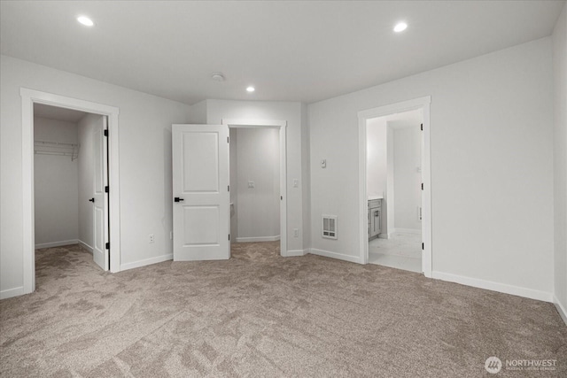 4955 Henley St, Blaine, WA 98230 - unfurnished bedroom with carpet flooring, a walk in closet, recessed lighting, ensuite bath, and a closet