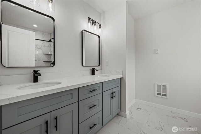 4955 Henley St, Blaine, WA 98230 - bathroom with marble finish floors, double vanity, and a shower