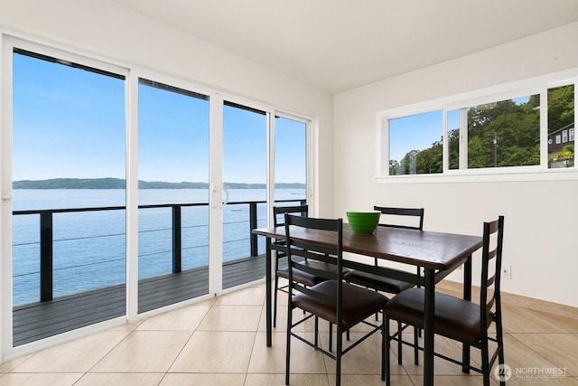 6522 Whitman St NE, Tacoma, WA 98422 - dining space featuring light tile patterned floors and a water view