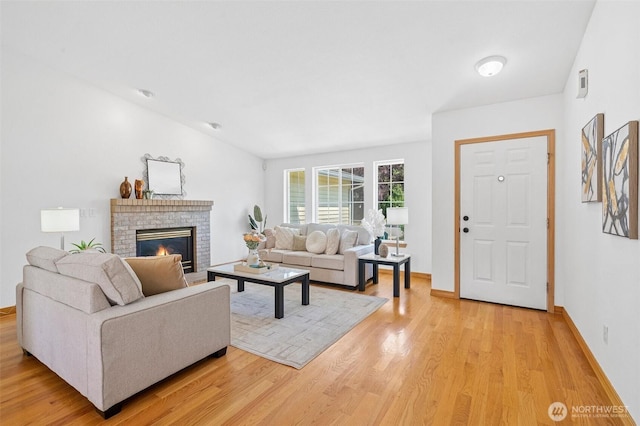 15120 61st St E, Sumner, WA 98390 - living area with light wood finished floors and a brick fireplace