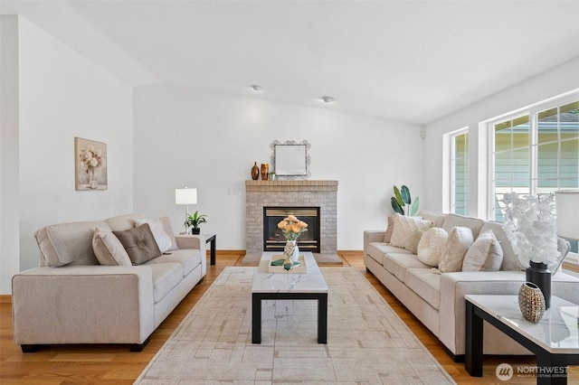 15120 61st St E, Sumner, WA 98390 - living room with light wood-style floors and a fireplace