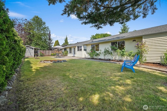 15120 61st St E, Sumner, WA 98390 - view of yard with a storage unit and a patio