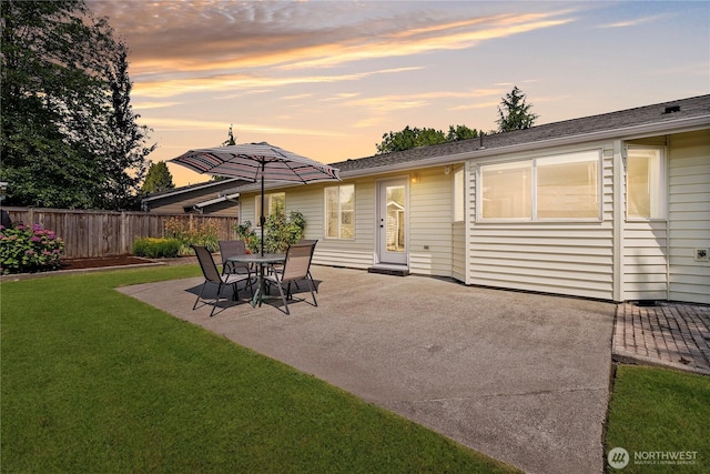 15120 61st St E, Sumner, WA 98390 - back of property at dusk featuring a patio