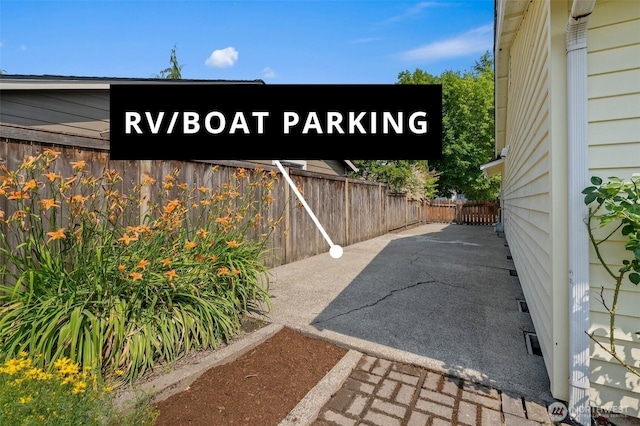 15120 61st St E, Sumner, WA 98390 - view of parking with a fenced backyard
