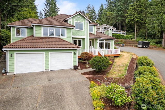 1802 Zephyr Ln NW, Silverdale, WA 98383 - view of front of home with asphalt driveway, a tile roof, and an attached garage