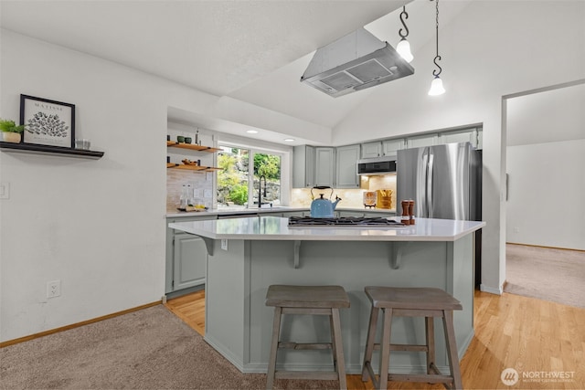1802 Zephyr Ln NW, Silverdale, WA 98383 - kitchen featuring stainless steel appliances, light countertops, a kitchen breakfast bar, gray cabinets, and vaulted ceiling