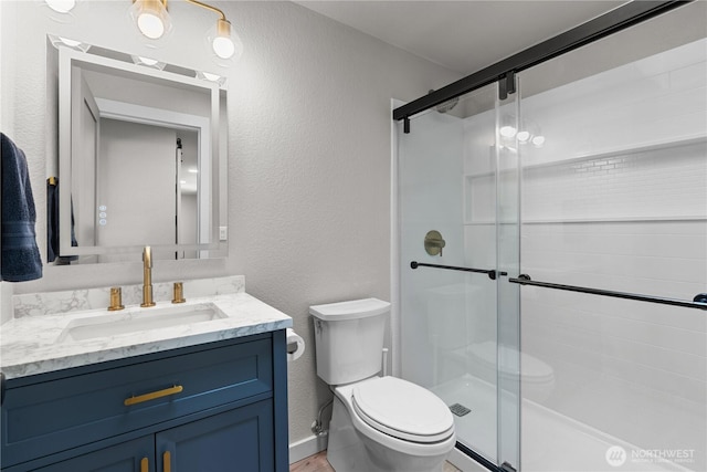 8209 188th Ave E, Bonney Lake, WA 98391 - full bath with vanity, a textured wall, and a stall shower