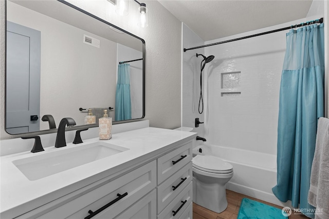 8209 188th Ave E, Bonney Lake, WA 98391 - bathroom featuring vanity, wood finished floors, shower / bath combo with shower curtain, and a textured wall