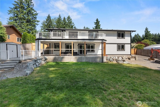 8209 188th Ave E, Bonney Lake, WA 98391 - back of property with a storage shed, a fenced backyard, a patio area, and a wooden deck