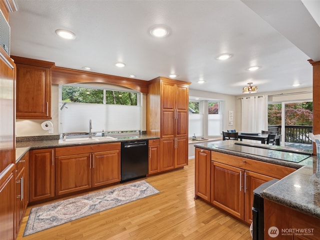 20801 Marine View Dr SW, Normandy Park, WA 98166 - kitchen featuring black appliances, light wood finished floors, brown cabinetry, healthy amount of natural light, and recessed lighting