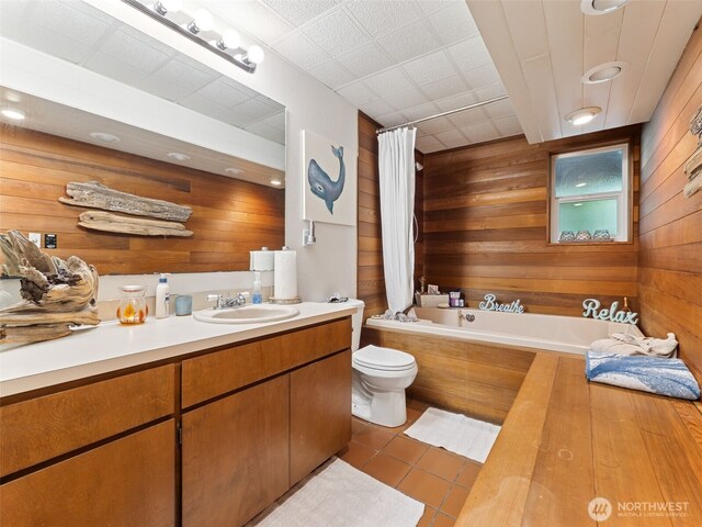 20801 Marine View Dr SW, Normandy Park, WA 98166 - bathroom with wood walls, vanity, tile patterned floors, and shower / tub combo with curtain