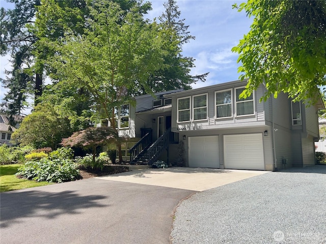 20801 Marine View Dr SW, Normandy Park, WA 98166 - view of front of home with asphalt driveway, a garage, and stairway