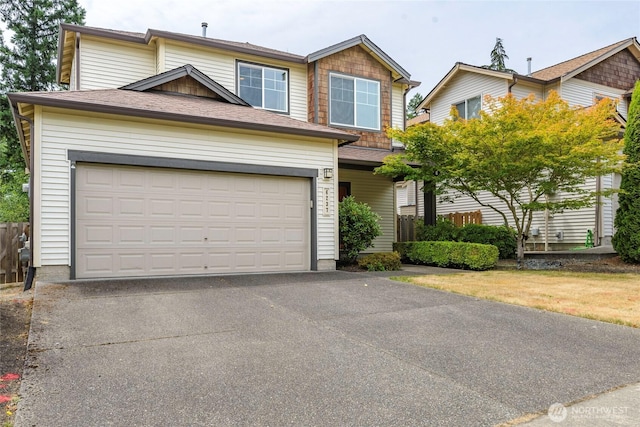6237 Wesley Pl SE, Auburn, WA 98092 - view of front of home with asphalt driveway and an attached garage