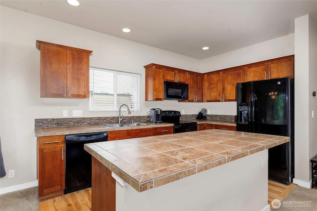 6237 Wesley Pl SE, Auburn, WA 98092 - kitchen featuring black appliances, recessed lighting, a center island, brown cabinets, and tile countertops