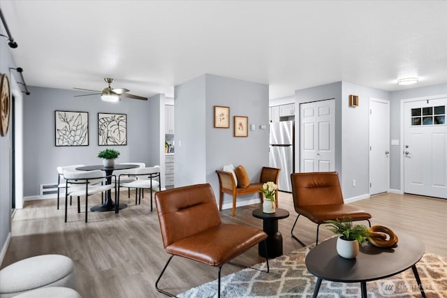 506 102nd Dr SE, Lake Stevens, WA 98258 - living room featuring light wood-style floors and a ceiling fan