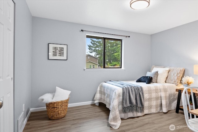 506 102nd Dr SE, Lake Stevens, WA 98258 - bedroom featuring wood finished floors and baseboards