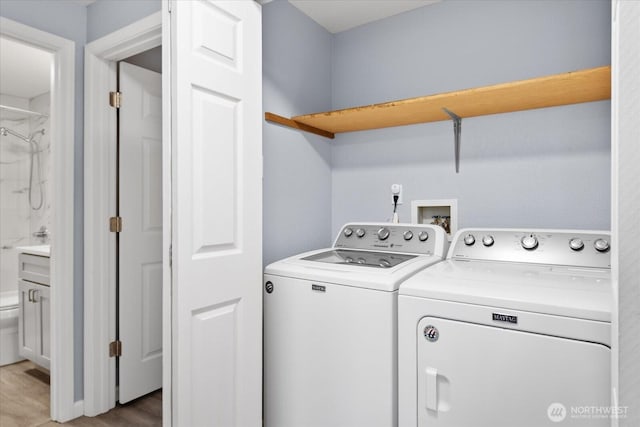 506 102nd Dr SE, Lake Stevens, WA 98258 - laundry room featuring washing machine and clothes dryer and light wood finished floors