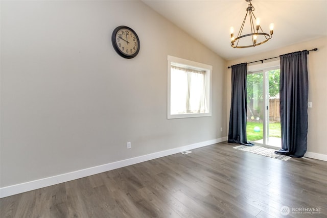 4706 56th St E, Tacoma, WA 98443 - unfurnished room with a chandelier, dark wood finished floors, and vaulted ceiling