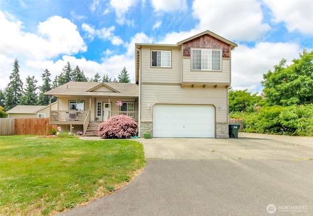 4706 56th St E, Tacoma, WA 98443 - view of front of home with covered porch, a garage, asphalt driveway, stairway, and brick siding