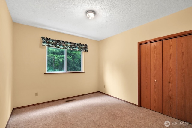 1931B State Route 505, Toledo, WA 98591 - unfurnished bedroom featuring light carpet, a closet, and a textured ceiling