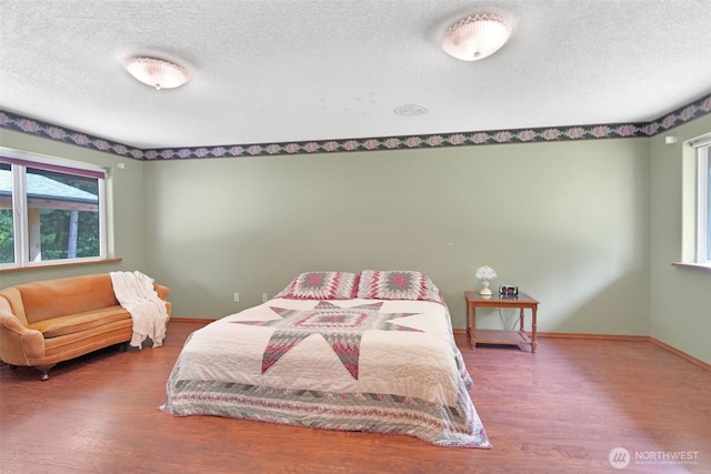 1931B State Route 505, Toledo, WA 98591 - bedroom with wood finished floors and a textured ceiling