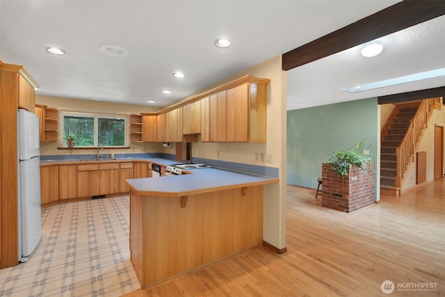 1931B State Route 505, Toledo, WA 98591 - kitchen featuring open shelves, freestanding refrigerator, a peninsula, a kitchen bar, and recessed lighting