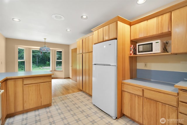 1931B State Route 505, Toledo, WA 98591 - kitchen featuring white appliances, recessed lighting, decorative light fixtures, light brown cabinetry, and light countertops