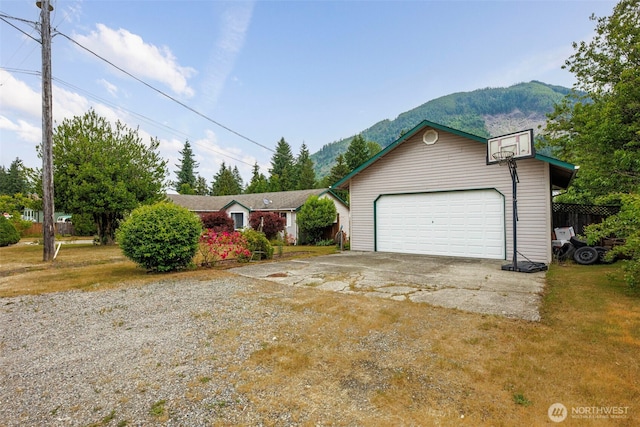 650 Elwell Ave, Darrington, WA 98241 - single story home with a mountain view, a garage, and an outdoor structure