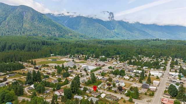 650 Elwell Ave, Darrington, WA 98241 - aerial perspective of suburban area with a heavily wooded area and a mountainous background