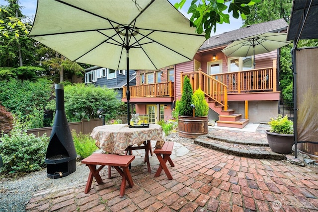 5250 35th Ave NE, Seattle, WA 98105 - view of patio / terrace with a fire pit, outdoor dining area, stairs, and a deck