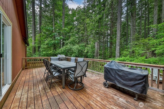 43920 SE 170th St, North Bend, WA 98045 - deck featuring outdoor dining space, a grill, and a view of trees