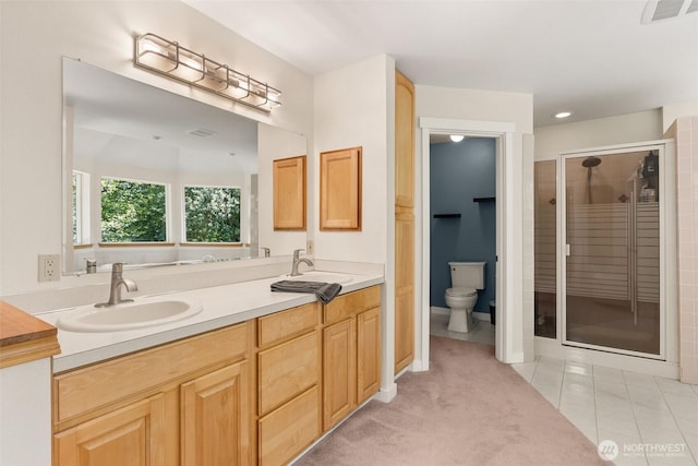 30630 24th Ave S, Roy, WA 98580 - bathroom featuring double vanity, a shower stall, tile patterned flooring, and recessed lighting