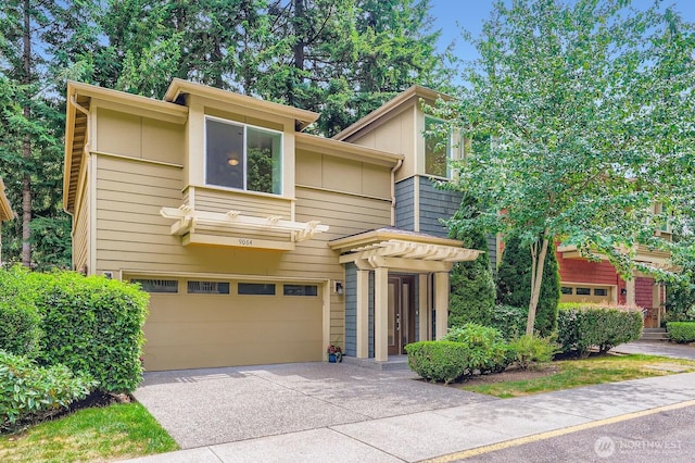 9064 177th Pl NE, Redmond, WA 98052 - view of front facade featuring a garage, concrete driveway, and board and batten siding