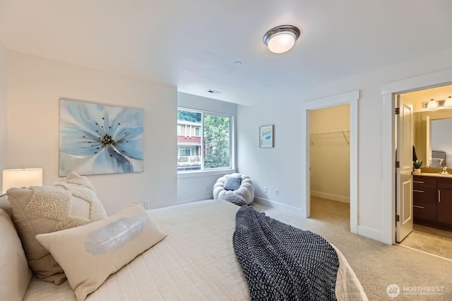 9064 177th Pl NE, Redmond, WA 98052 - bedroom featuring light carpet, a spacious closet, and ensuite bath