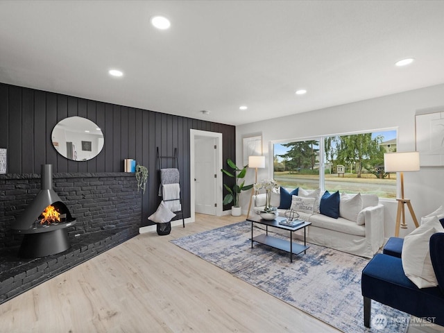 3704 Bells Ln, Langley, WA 98260 - living room featuring wood finished floors, recessed lighting, and a wood stove