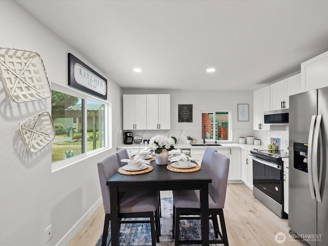 3704 Bells Ln, Langley, WA 98260 - dining space featuring light wood-style flooring and recessed lighting