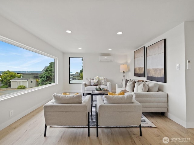3704 Bells Ln, Langley, WA 98260 - living room with an AC wall unit, light wood finished floors, and recessed lighting