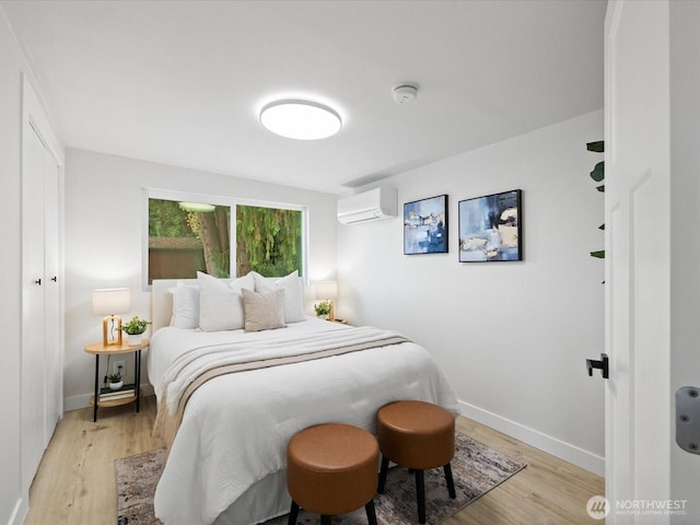3704 Bells Ln, Langley, WA 98260 - bedroom with an AC wall unit and light wood-style floors