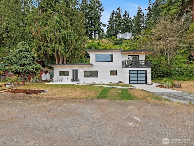 3704 Bells Ln, Langley, WA 98260 - contemporary house featuring driveway, a garage, and a front lawn