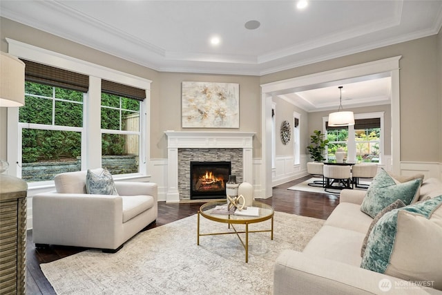 1709 223rd Ave SE, Sammamish, WA 98075 - living room featuring plenty of natural light, a raised ceiling, a decorative wall, ornamental molding, and wainscoting