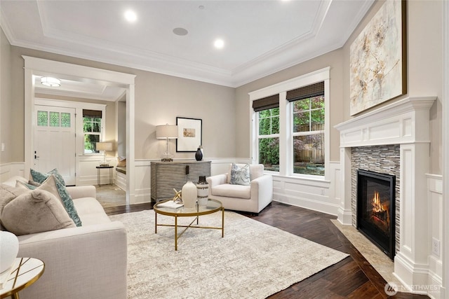 1709 223rd Ave SE, Sammamish, WA 98075 - living room with dark wood-type flooring, wainscoting, a fireplace, a decorative wall, and ornamental molding