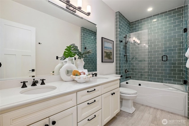 1709 223rd Ave SE, Sammamish, WA 98075 - full bath featuring double vanity, wood finished floors, washtub / shower combination, and recessed lighting