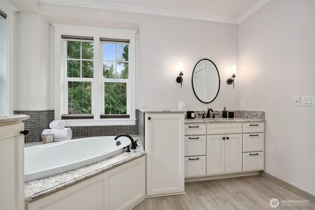 1709 223rd Ave SE, Sammamish, WA 98075 - bathroom with vanity, a bath, ornamental molding, and wood finished floors