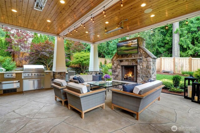 1709 223rd Ave SE, Sammamish, WA 98075 - view of patio / terrace featuring exterior kitchen and an outdoor living space with a fireplace