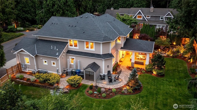 1709 223rd Ave SE, Sammamish, WA 98075 - rear view of house featuring a patio area, a fenced backyard, and roof with shingles