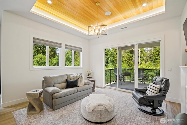 9051 Sea Mist Ln, Blaine, WA 98230 - living room featuring a tray ceiling, wooden ceiling, wood finished floors, a chandelier, and recessed lighting