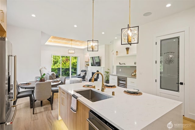 9051 Sea Mist Ln, Blaine, WA 98230 - kitchen featuring stainless steel appliances, light wood-type flooring, modern cabinets, wine cooler, and recessed lighting