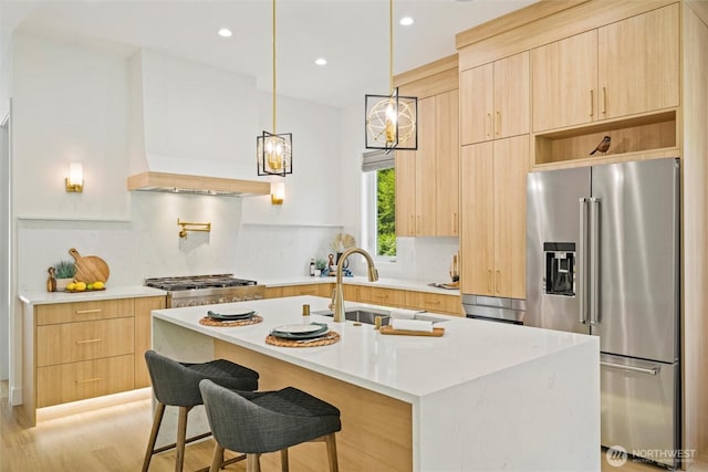 9051 Sea Mist Ln, Blaine, WA 98230 - kitchen with high quality fridge, light brown cabinetry, modern cabinets, backsplash, and recessed lighting